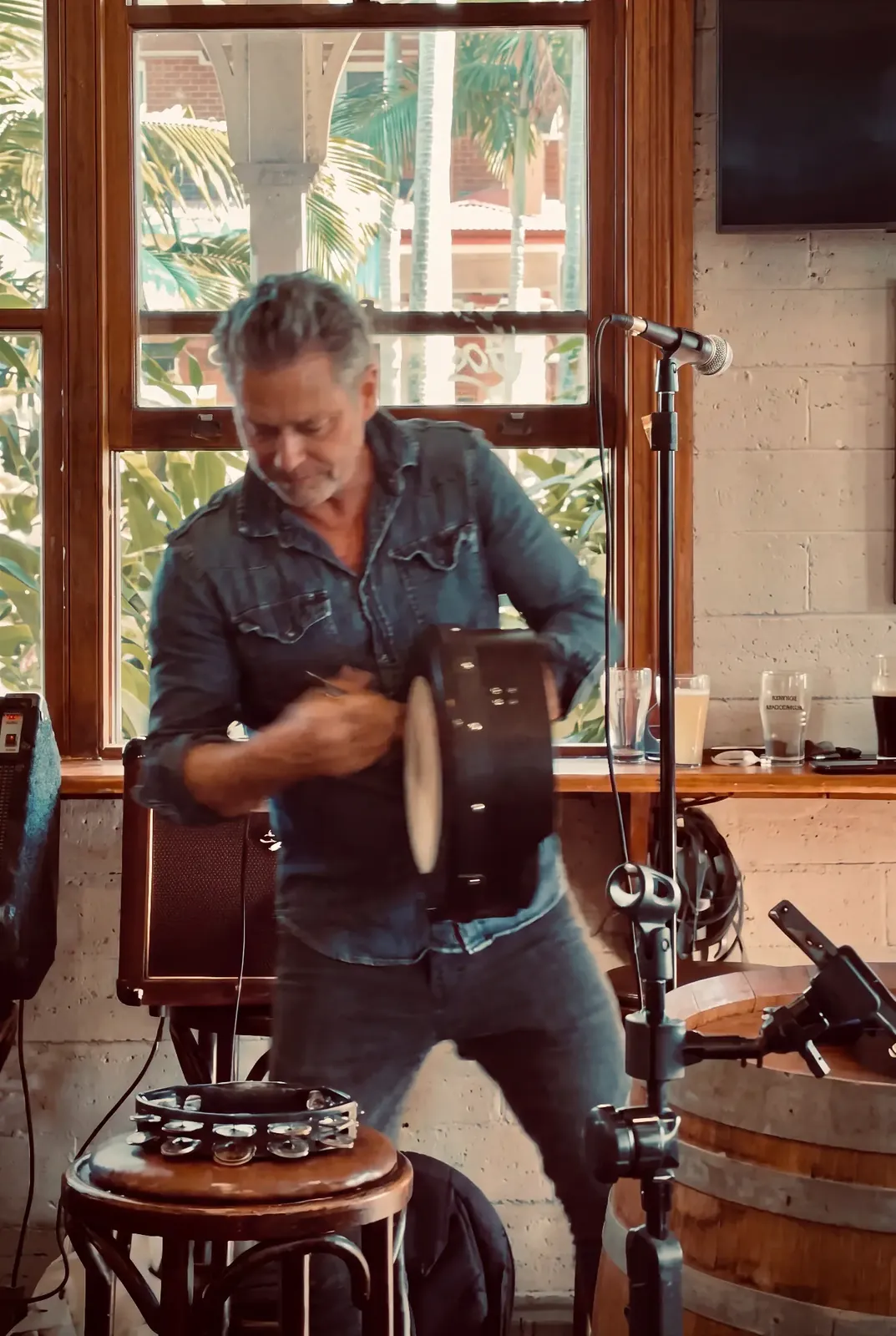 Cam playing the bodhran at the Sunday session