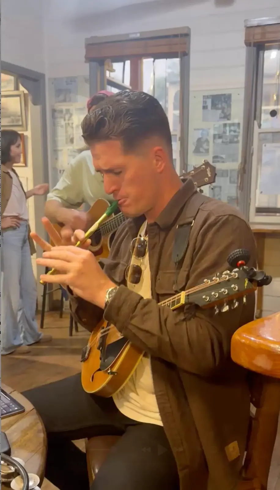 Lachy playing tin whistle and mandolin
